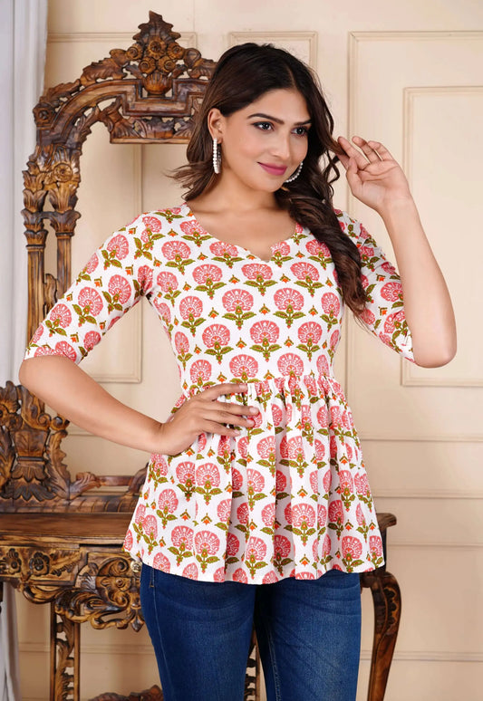 Close-up of woman in floral rayon kurti with pearl earrings and styled hair