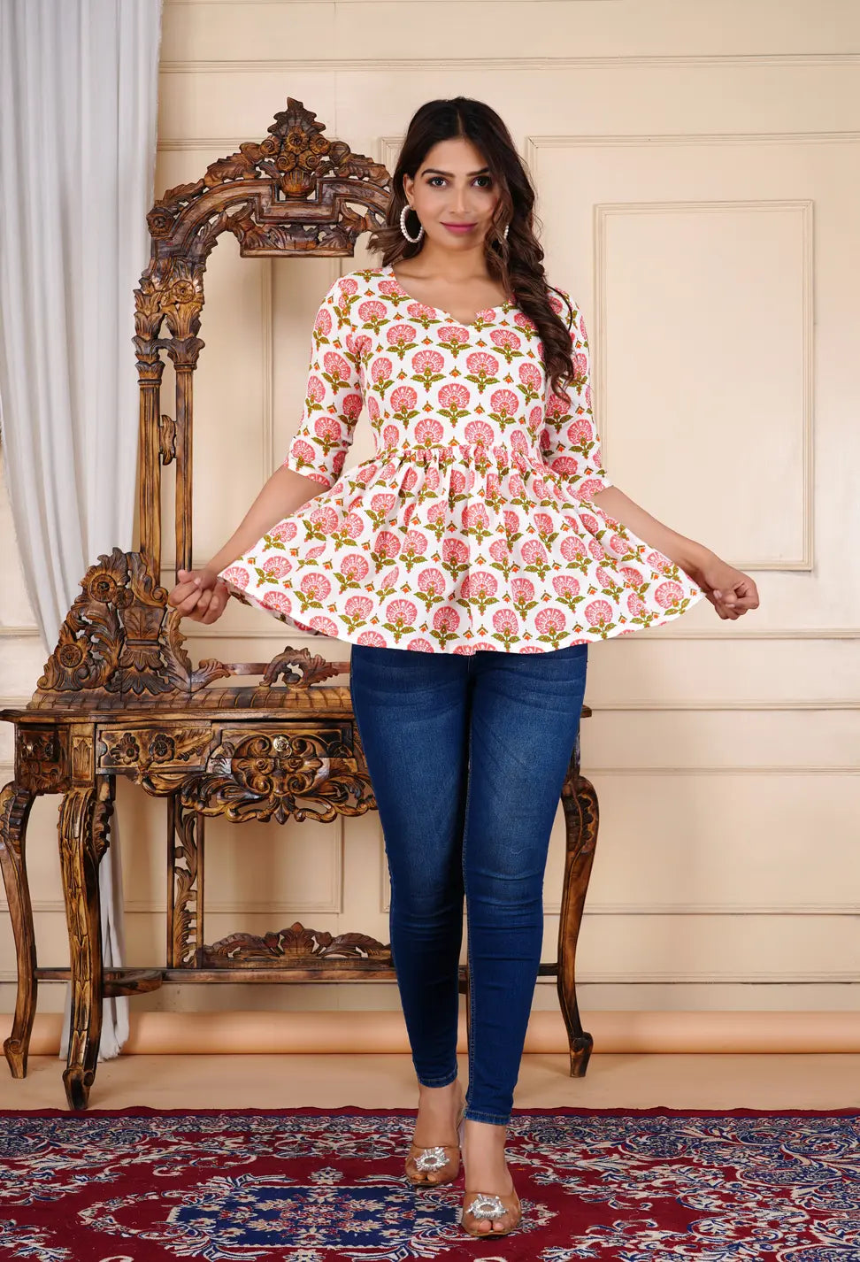 Women wearing white ethnic peplum top with blue jeans — full length casual outfit