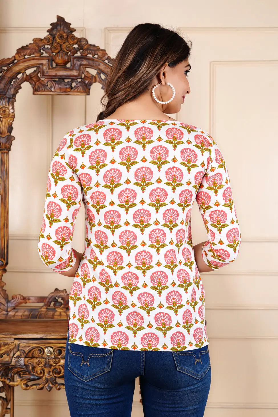 Women in white ethnic printed straight top with blue jeans — daily wear India