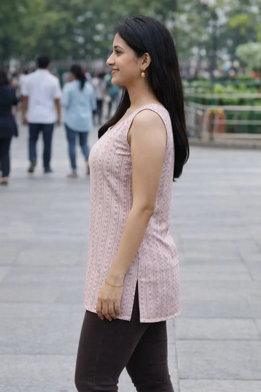 Women wearing pink sleeveless kurti with black leggings — ethnic casual outfit